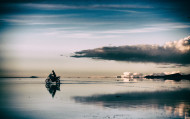 UYUNI, BOLIVIA - JANUARY 11:  (EDITORS NOTE: This image was processed using digital filters) A local man rides his motorbike as the sun sets over the Salar de Uyuni of Uyuni Salt Flat during Day 7 of the 2014 Dakar Rally on January 11, 2014 in Uyuni, Bolivia.  (Photo by Dean Mouhtaropoulos/Getty Images)